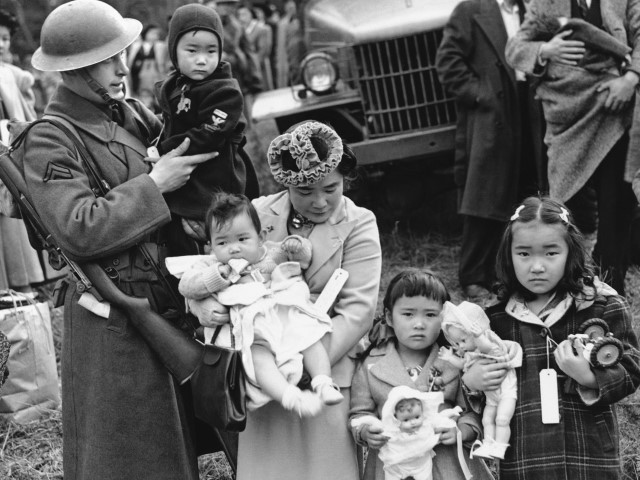 Mrs. Shigeho Kitamoto is evacuated along with other Japanese from Bainbridge Island in Washington State, March 30, 1942. Uncredited / ASSOCIATED PRESS